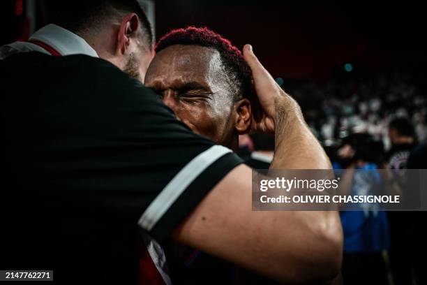 Paris' US point guard Timothy Neocartes TJ Shorts reacts after winning the Eurocup second leg basketball match between JL Bourg and Paris basketball...