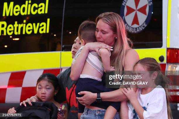 Family leaves the Westfield Bondi Junction shopping mall after a stabbing incident in Sydney on April 13, 2024. Australian police on April 13 said...