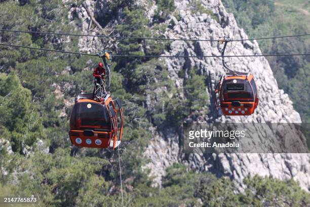 Evacuation work continues in the cabins suspended in the air after a cable car cabin crashed into a fallen cable car pole at the Tunektepe Cable Car...