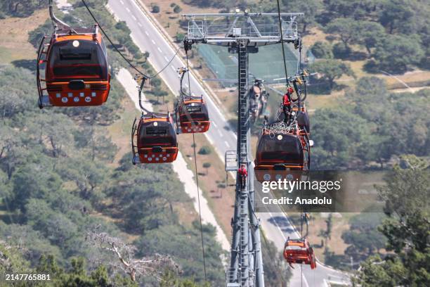 Evacuation work continues in the cabins suspended in the air after a cable car cabin crashed into a fallen cable car pole at the Tunektepe Cable Car...