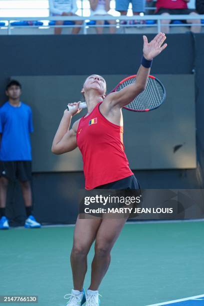 Belgian Sofia Costoulas prepares to serve during the first match between US Pegula and Belgian Costoulas on the first day of the meeting between USA...