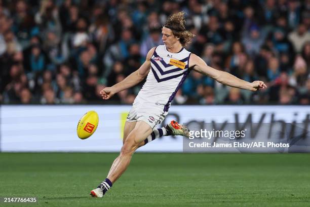 Nat Fyfe of the Dockers kicks the ball during the 2024 AFL Round 05 match between the Port Adelaide Power and the Fremantle Dockers at Adelaide Oval...