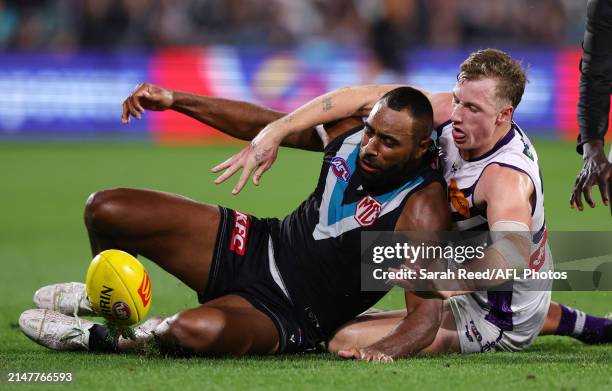 Esava Ratugolea of the Power and Josh Treacy of the Dockers during the 2024 AFL Round 05 match between the Port Adelaide Power and the Fremantle...