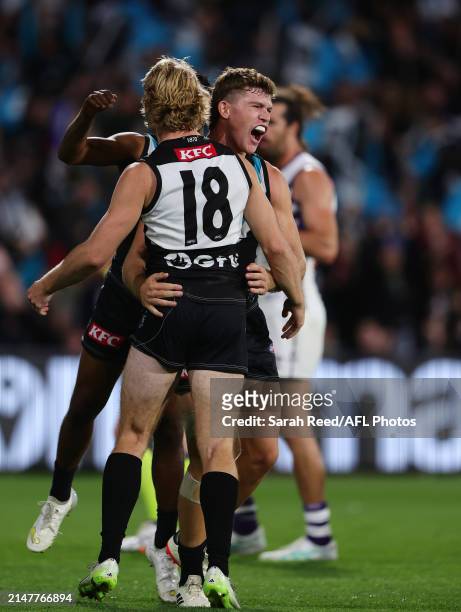 Mitch Georgiades of the Power /hugs Jason Horne-Francis of the Power /after he kicked a goal during the 2024 AFL Round 05 match between the Port...