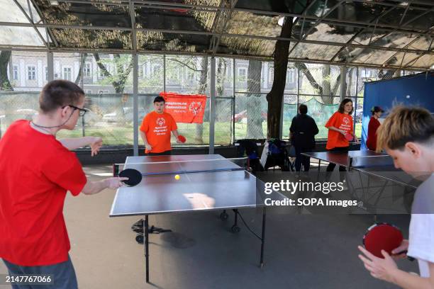 People with special needs play table tennis at Starobazarny Square. Despite the ongoing conflict with Russia, the NGO "Foundation for Special Youth...