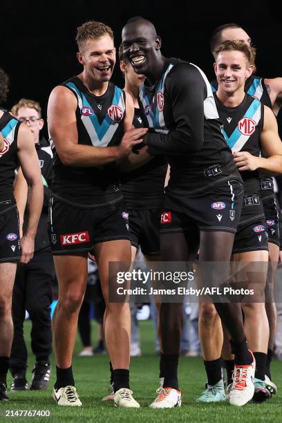 Dan Houston and Aliir Aliir of the Power celebrate their win during the 2024 AFL Round 05 match between the Port Adelaide Power and the Fremantle...