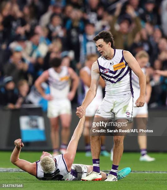 Jordan Clark of the Dockers pulls up Luke Ryan of the Dockers after the loss during the 2024 AFL Round 05 match between the Port Adelaide Power and...