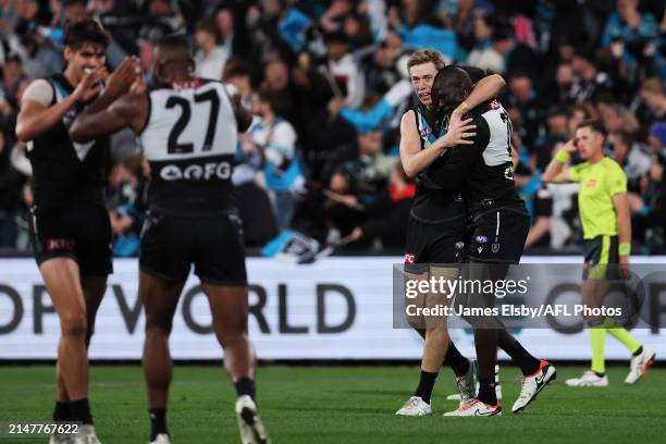 Todd Marshall and Aliir Aliir of the Power celebrate there win during the 2024 AFL Round 05 match between the Port Adelaide Power and the Fremantle...