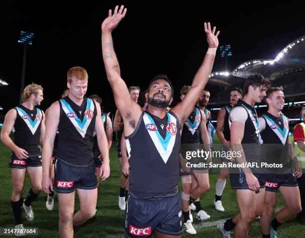 Willie Rioli of the Power waves to fans as he walks off the oval after the win during the 2024 AFL Round 05 match between the Port Adelaide Power and...