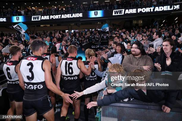 Power players walk off after the win during the 2024 AFL Round 05 match between the Port Adelaide Power and the Fremantle Dockers at Adelaide Oval on...