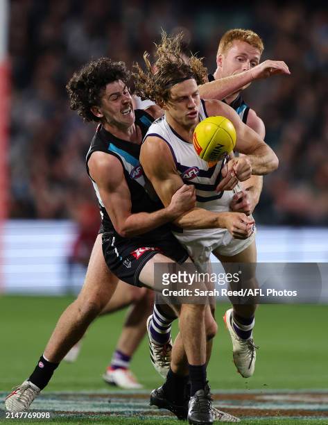 Darcy Byrne-Jones of the Power and Nat Fyfe of the Dockers during the 2024 AFL Round 05 match between the Port Adelaide Power and the Fremantle...