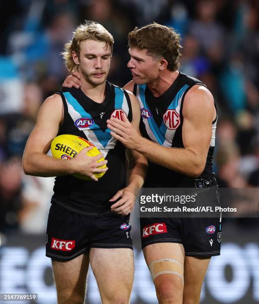 Jason Horne-Francis of the Power gets some advice from Mitch Georgiades of the Power after before lining up for goal during the 2024 AFL Round 05...