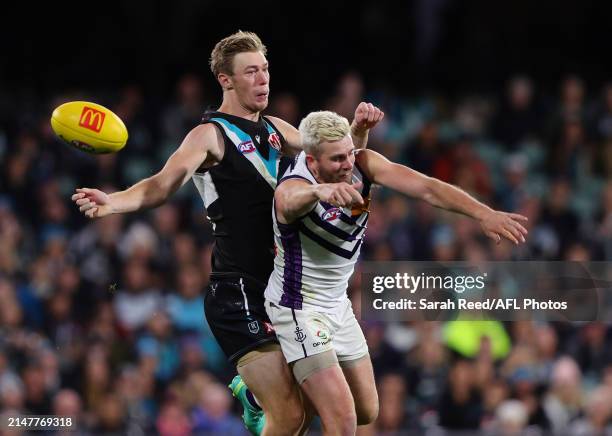 Todd Marshall of the Power and Luke Ryan of the Dockers during the 2024 AFL Round 05 match between the Port Adelaide Power and the Fremantle Dockers...