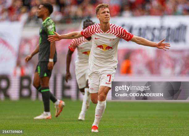 Leipzig's Spanish forward Dani Olmo celebrates his 1-0 during the German first division Bundesliga football match RB Leipzig v VfL Wolfsburg in...