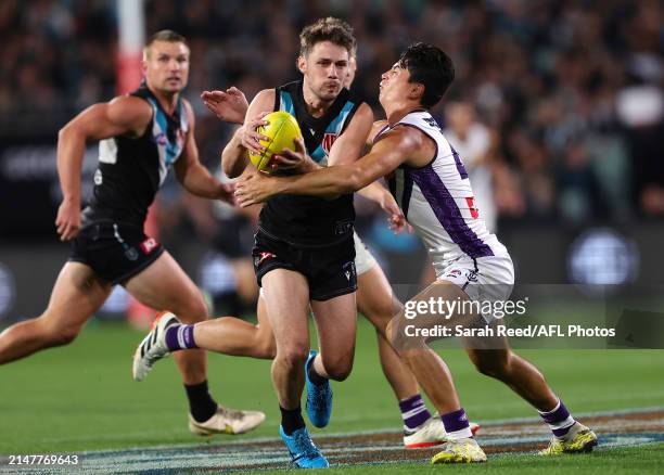 Jed McEntee of the Power and Bailey Banfield of the Dockers during the 2024 AFL Round 05 match between the Port Adelaide Power and the Fremantle...