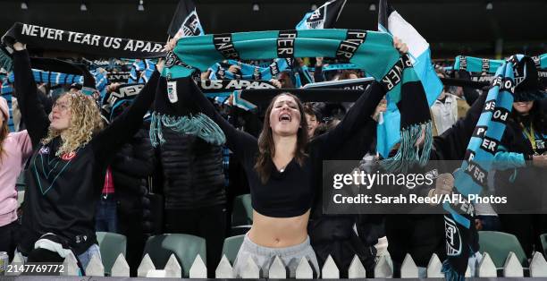 Port Fans singing "Never Tear Us Apart" during the 2024 AFL Round 05 match between the Port Adelaide Power and the Fremantle Dockers at Adelaide Oval...