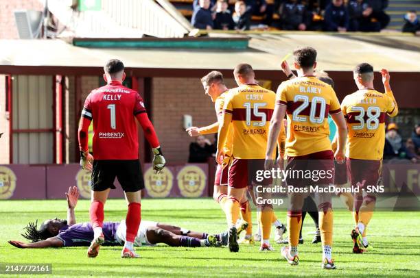 Motherwell's Blair Spittal confronts Hibs Rocky Bushiri during a cinch Premiership match between Motherwell and Hibernian at Fir Park, on April 13 in...