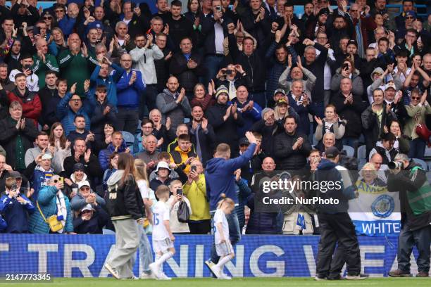 Stuart Dallas is walking the pitch with his family at halftime during the SkyBet Championship match between Leeds United and Blackburn Rovers at...