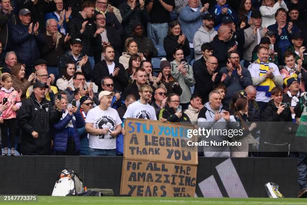 Stuart Dallas is walking the pitch with his family at halftime during the SkyBet Championship match between Leeds United and Blackburn Rovers at...