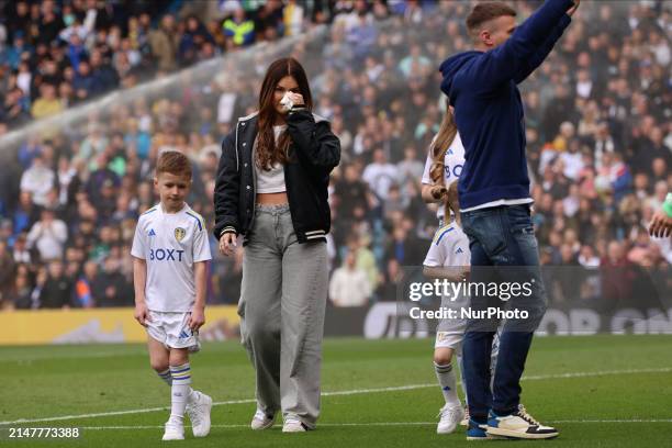 Stuart Dallas is walking the pitch with his family at halftime during the SkyBet Championship match between Leeds United and Blackburn Rovers at...