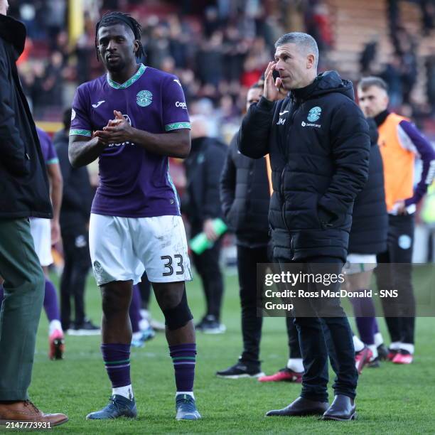 Hibs Manager Nick Montgomery and Rocky Bushiri during a cinch Premiership match between Motherwell and Hibernian at Fir Park, on April 13 in...