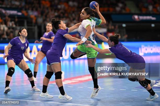 Slovenia's centre back Elizabeth Omoregie jumps to shoot during the women's Handball Olympic qualifying match between Slovenia and Paraguay in...