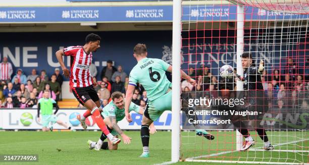 Lincoln City's Reeco Hackett has an effort ruled out by referee Martin Coy during the Sky Bet League One match between Lincoln City and Wigan...