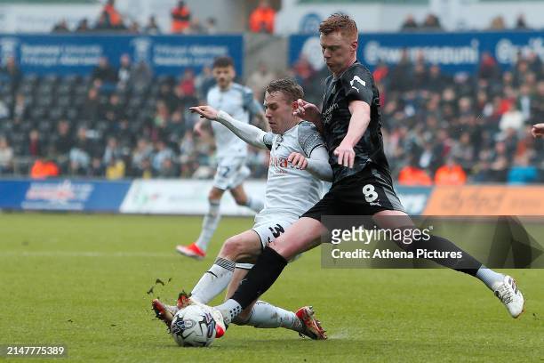 Oliver Cooper of Swansea City challenged by Sam Clucas of Rotherham United during the Sky Bet Championship match between Swansea City and Rotherham...