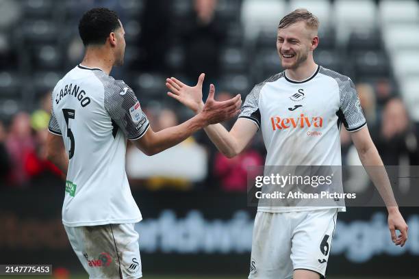 Ben Cabango and Harry Darling of Swansea City shake hands after the Sky Bet Championship match between Swansea City and Rotherham United at the...