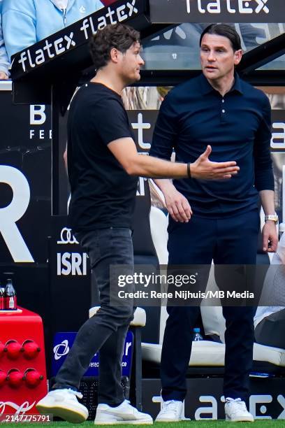 Head Coach Edin Terzic of Borussia Dortmund talks to Borussia Mönchengladbach head coach Gerardo Seoane during the Bundesliga match between Borussia...