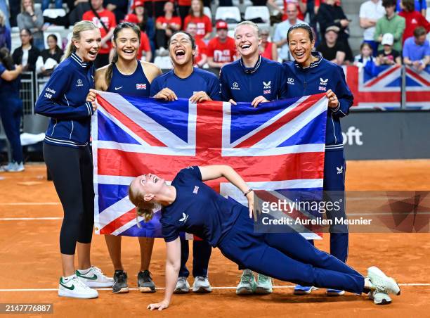 Katie Boulter, Emma Raducanu, Heather Watson, Harriet Dart, Captain Anne Keothavong and Francesca Jones of Great Britain celebrate after winning...