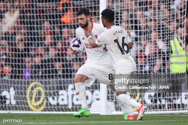 Bruno Fernandes of Manchester United scores a goal to make the penalty goal to make it 2-2 during the Premier League match between AFC Bournemouth...