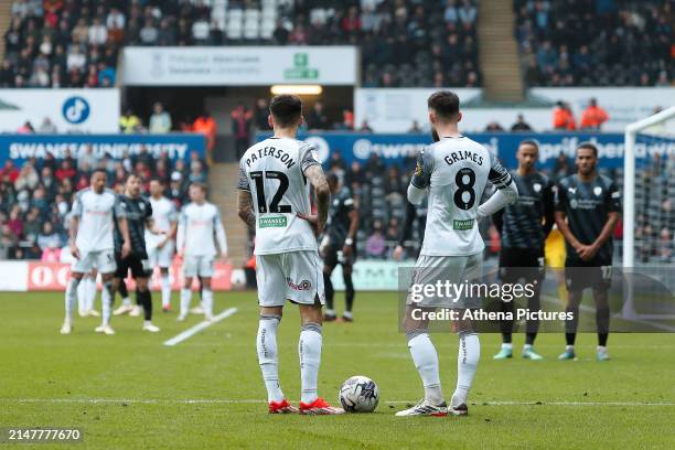 Jamie Paterson and Matt Grimes of Swansea City prepare for a free kick during the Sky Bet Championship match between Swansea City and Rotherham...