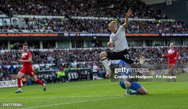 Derby County's Louie Sibley against Leyton Orient goalkeeper Sol Bryan during the Sky Bet League One match at Pride Park Stadium, Derby. Picture...