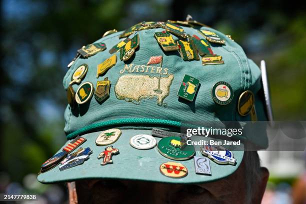 Detail photo of a patron's hat with Masters pins during the third round of Masters Tournament at Augusta National Golf Club on April 13, 2024 in...
