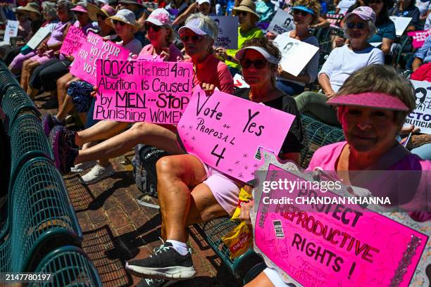 Pro-abortion rights activists participate in the "Rally for Our Freedom" to protect abortion rights for Floridians, in Orlando, Florida, on April 13,...