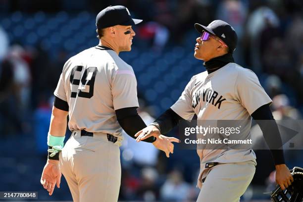 Aaron Judge and Juan Soto of the New York Yankees celebrate the team's 3-2 win over the Cleveland Guardians in game one of a doubleheader at...