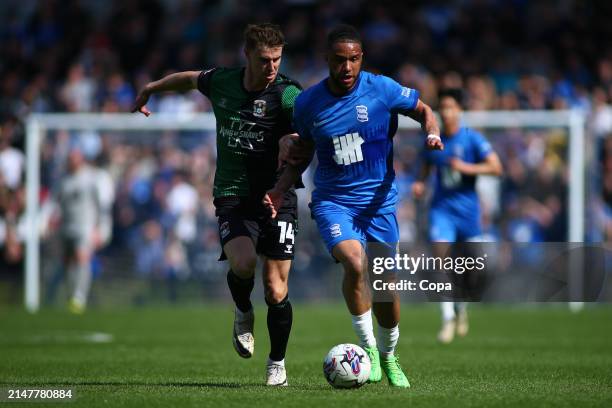 Tyler Roberts of Birmingham City battles for possession with Ben Sheaf of Coventry City during the Sky Bet Championship match between Birmingham City...