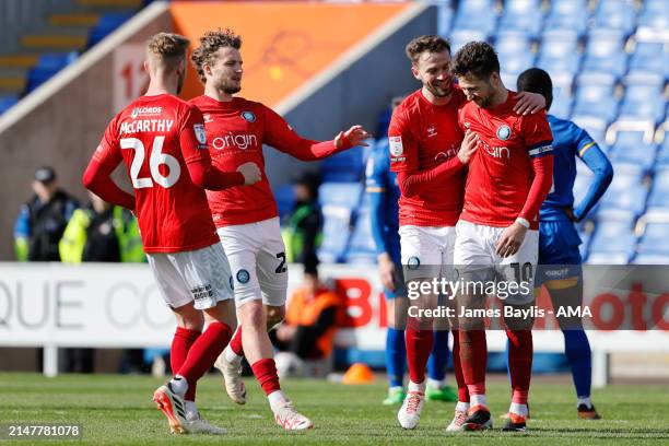 Luke Leahy of Wycombe Wanderers celebrates with his team mates after scoring a goal to make it 0-1 during the Sky Bet League One match between...