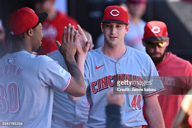 Nick Lodolo of the Cincinnati Reds gets high fives after being taken out of the game in the sixth inning against the Chicago White Sox at Guaranteed...