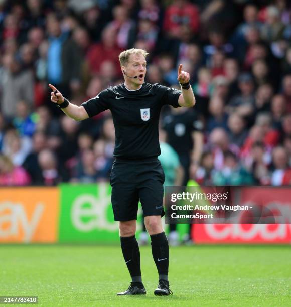 Referee Martin Coy during the Sky Bet League One match between Lincoln City and Wigan Athletic at LNER Stadium on April 13, 2024 in Lincoln, England.