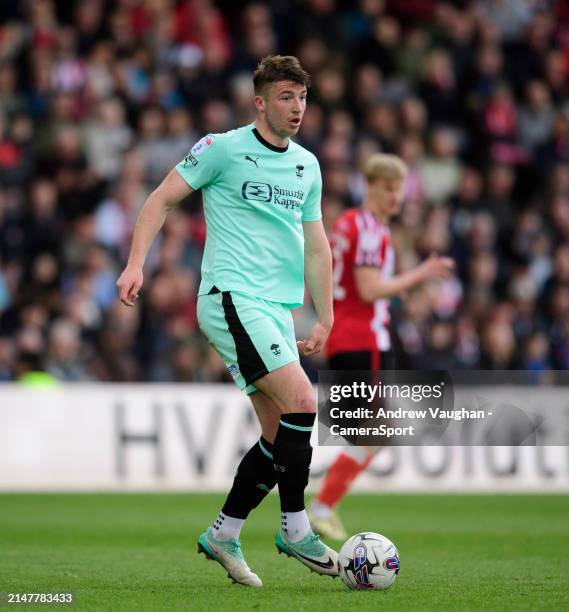 Wigan Athletic's Charlie Hughes during the Sky Bet League One match between Lincoln City and Wigan Athletic at LNER Stadium on April 13, 2024 in...