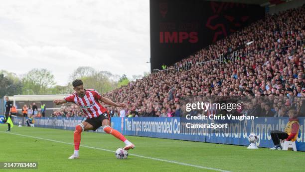 Lincoln City's Reeco Hackett during the Sky Bet League One match between Lincoln City and Wigan Athletic at LNER Stadium on April 13, 2024 in...