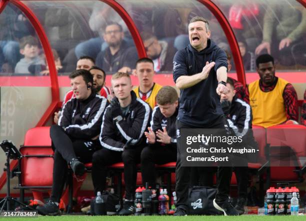 Lincoln City head coach Michael Skubala shouts instructions to his team from the technical area during the Sky Bet League One match between Lincoln...