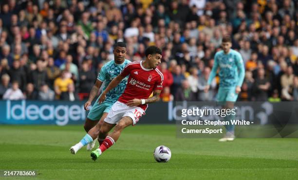 Nottingham Forest's Morgan Gibbs-White shields the ball from Wolverhampton Wanderers' Mario Lemina during the Premier League match between Nottingham...