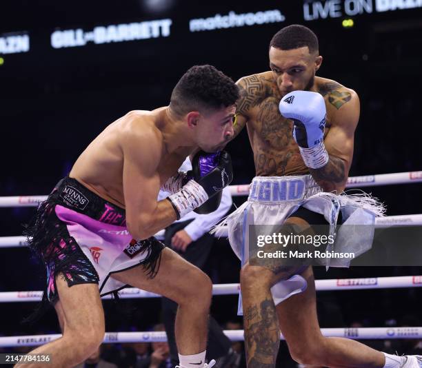 Jordan Gill and Zelfa Barrett during their WBA International Super Featherweight Title Contest at AO Arena on April 13, 2024 in Manchester, England.