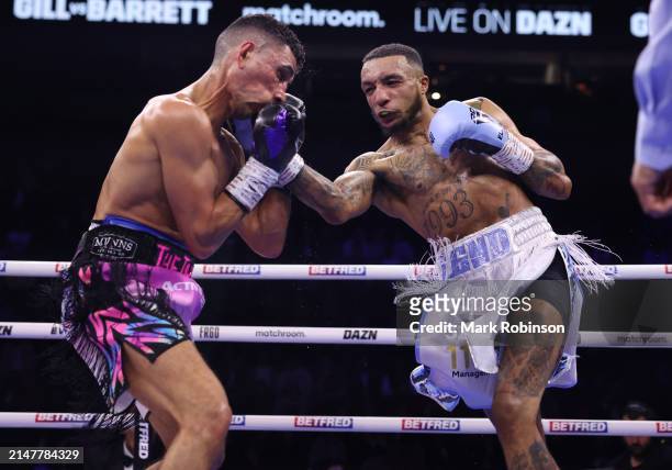 Jordan Gill and Zelfa Barrett during their WBA International Super Featherweight Title Contest at AO Arena on April 13, 2024 in Manchester, England.