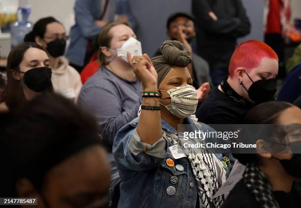 Activist Amadi Hall reacts to a speaker during a meeting of the Coalition to March on the Democratic National Convention on Saturday, April 13 in...