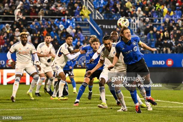 Samuel Piette of CF Montréal heads the ball during the first half against FC Cincinnati at Saputo Stadium on April 13, 2024 in Montreal, Quebec,...