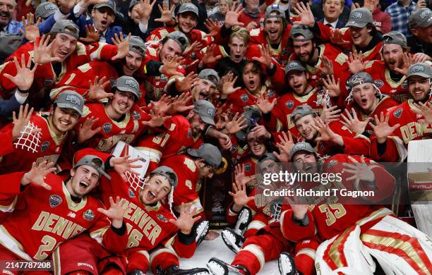 The Denver Pioneers celebrate a win during the NCAA Men's Hockey Frozen Four final at the Xcel Energy Center on April 13, 2024 in St. Paul,...